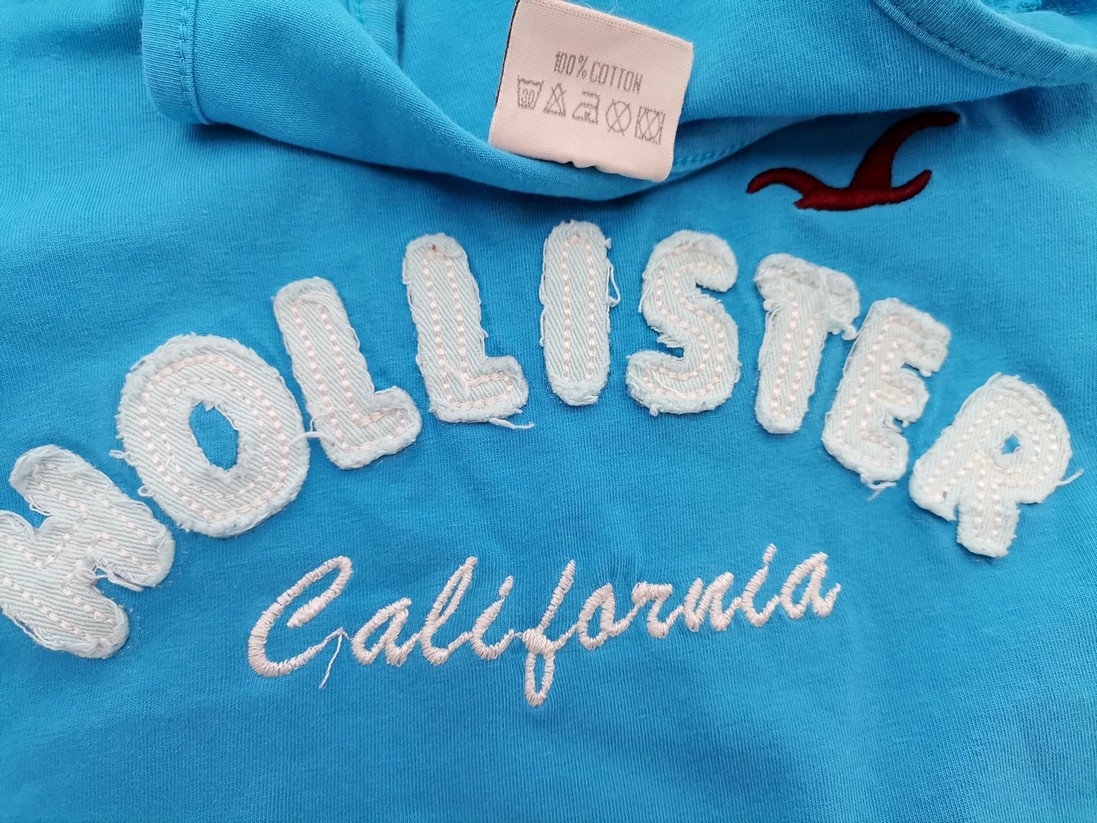 Hollister Rozmiar XL Kolor Niebieski Okrągły dekolt Bluzka Bezrękawnik Materiał Bawełna 100%